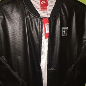 Women’s (passes unisex) black Nike leather